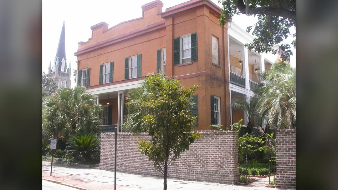 Antebellum stucco exterior of the Sorrel-Weed House in Savannah, Georgia