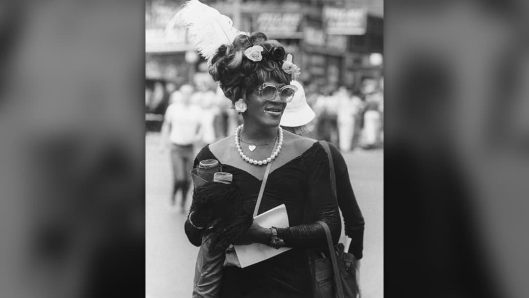 Historic photograph of activist Marsha P. Johnson smiling outdoors