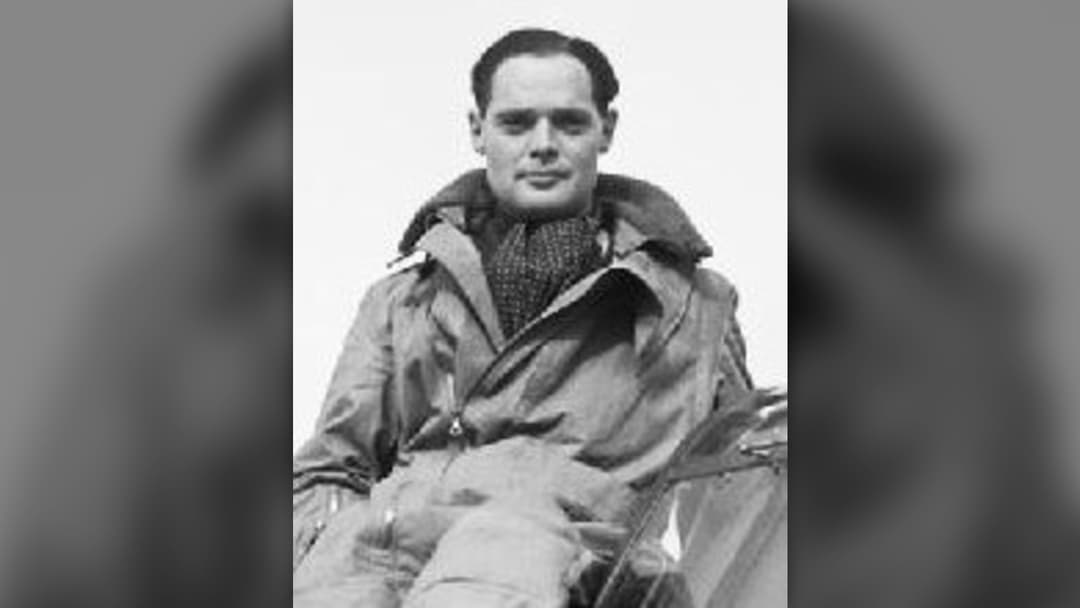 Royal Air Force Squadron Leader Douglas Bader seated on the cockpit of his Hawker Hurricane fighter at Duxford in 1940