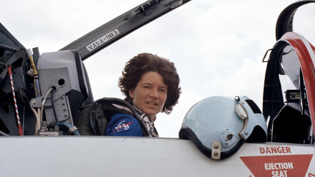 NASA astronaut Sally Ride seated in the cockpit of a supersonic T-38 Talon jet aircraft