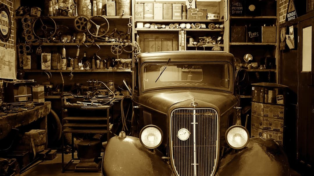 Garage workshop packed with tools, shelves, and storage equipment