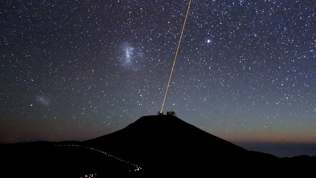 Paranal Observatory telescopes observing the southern night sky under the Milky Way