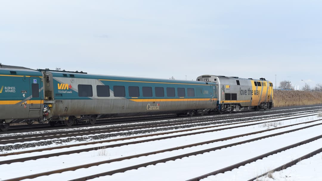 A VIA Rail Canada passenger train traveling through snowy Ontario.
