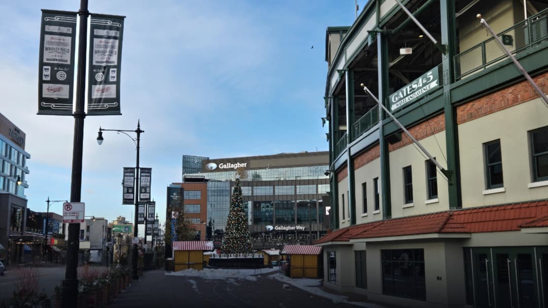 Snow drifts piled outside the iconic red marquee gates of Wrigley Field in Chicago.