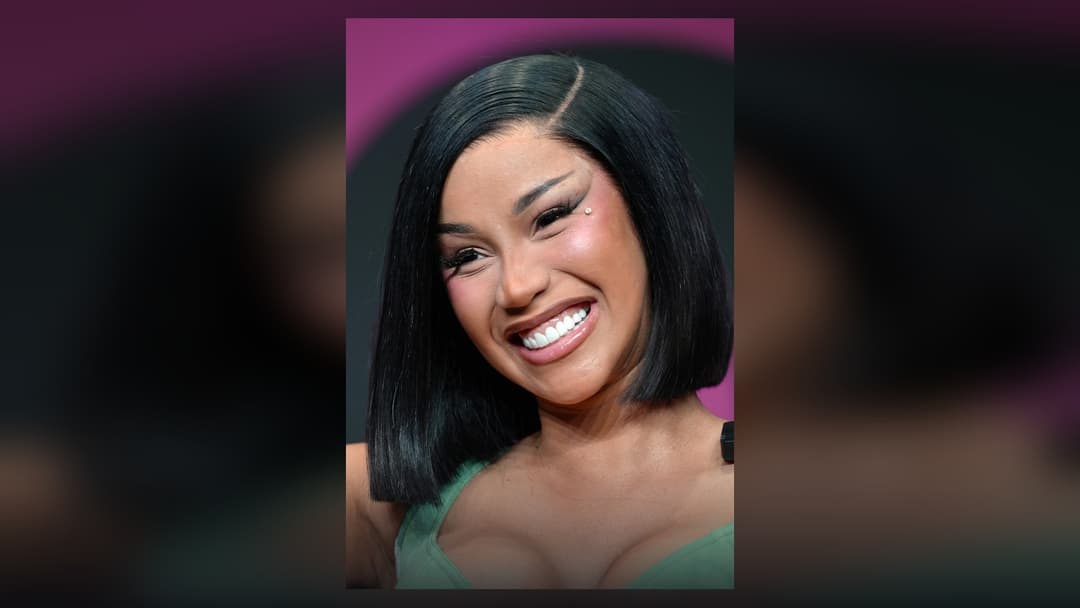 Cardi B performing live on stage at a major music festival
