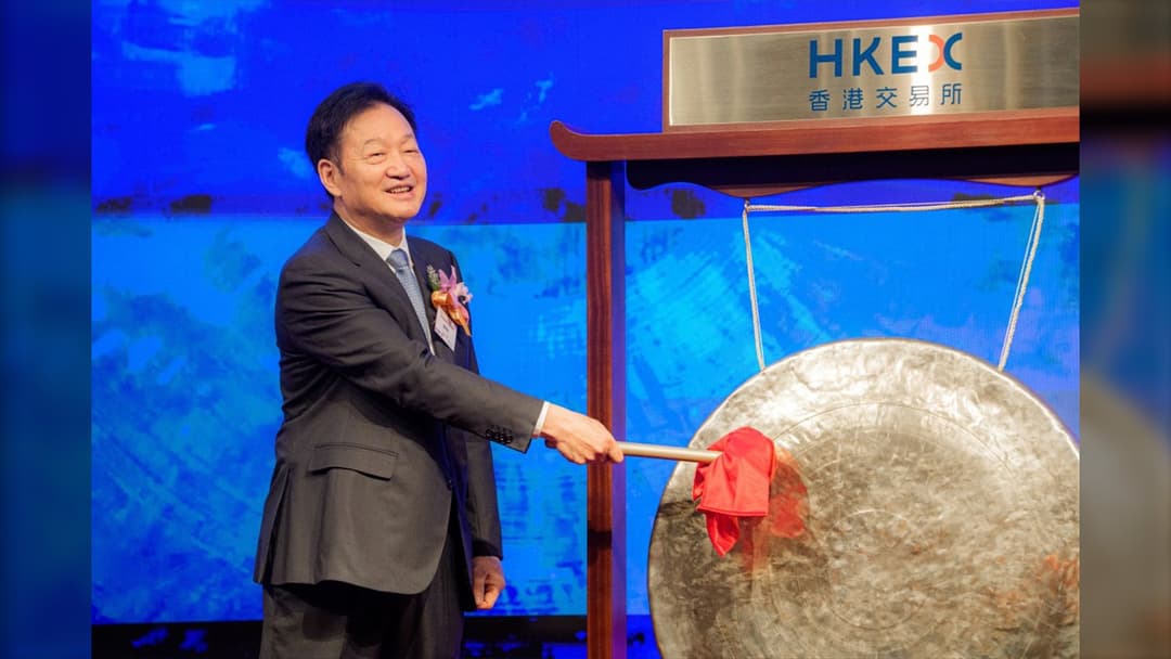 Portrait of Muyuan Foods chairman Qin Yinglin at the Hong Kong Stock Exchange listing ceremony