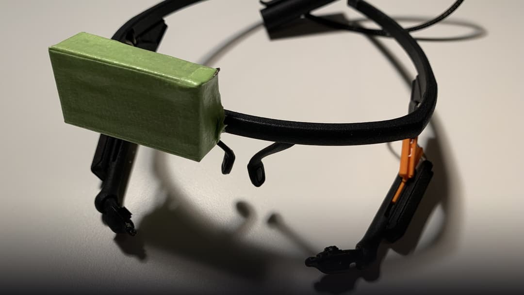 Hardware pupil-tracking optical rig showing infrared illuminators and gaze-direction cameras.