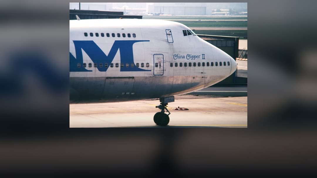 Pan American World Airways (Pan Am) Boeing 747 Clipper aircraft in iconic blue globe livery on tarmac.
