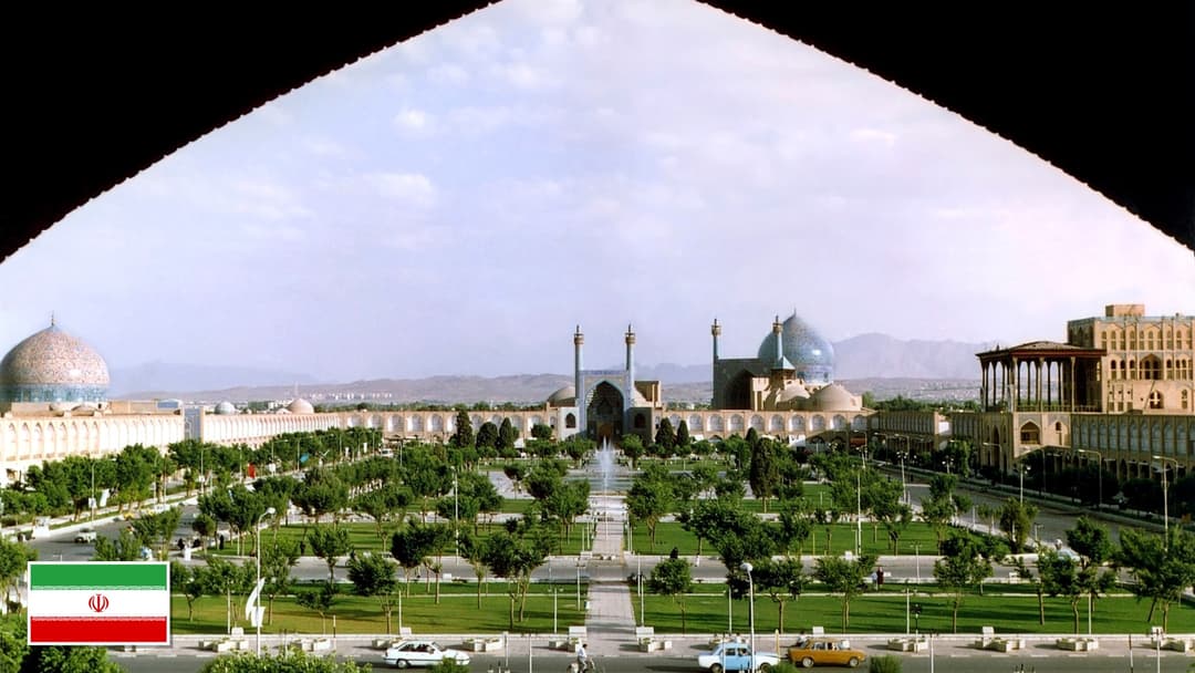 Naqsh-e Jahan Square and Shah Mosque in Isfahan, Iran with the Iranian flag in the bottom left corner