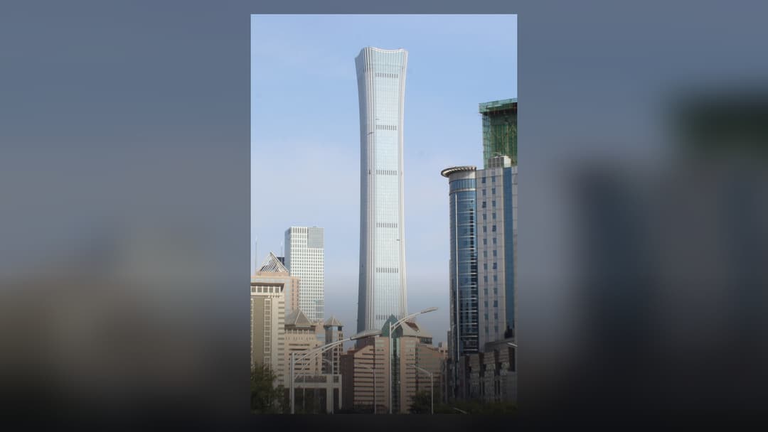 CITIC Tower (China Zun) soaring into the clear blue sky above Beijing's central business district.
