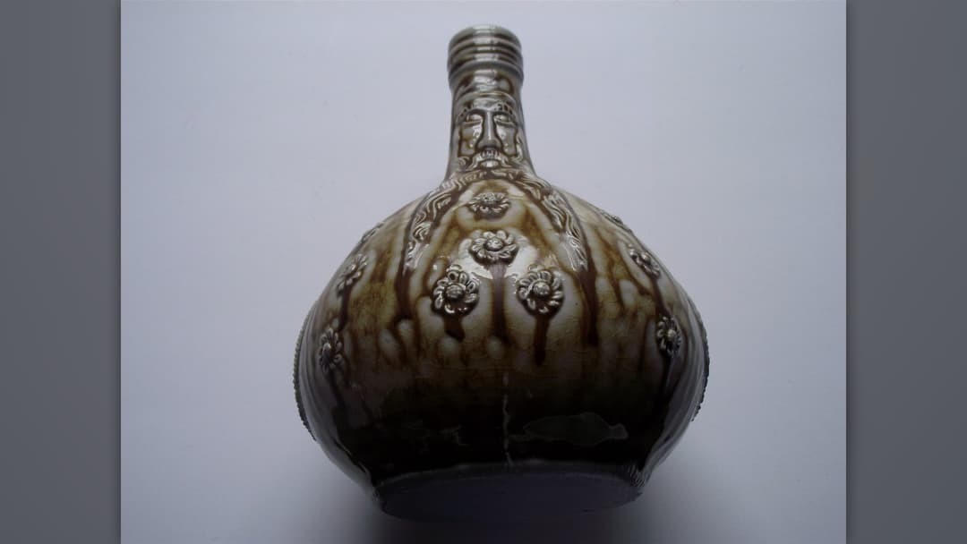 Historic Bellarmine stoneware witch bottle with bearded mask