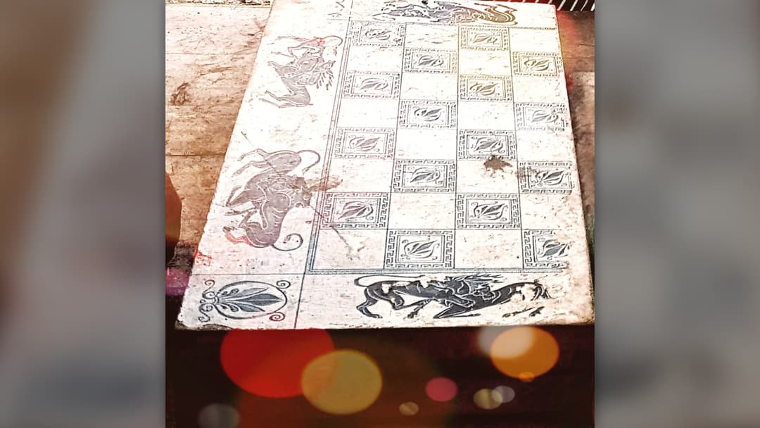 Wooden Backgammon board open with checkers and dice
