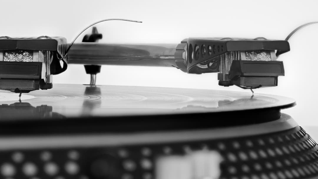 Close-up of vinyl record groove and stylus needle