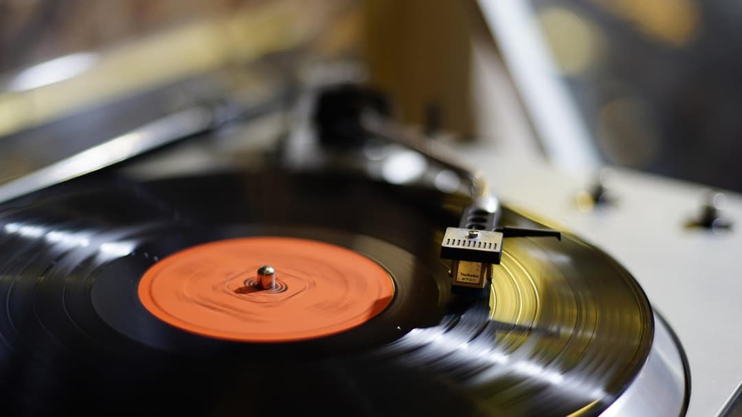 2. 45 RPM Vinyl Records With The Large Center Hole