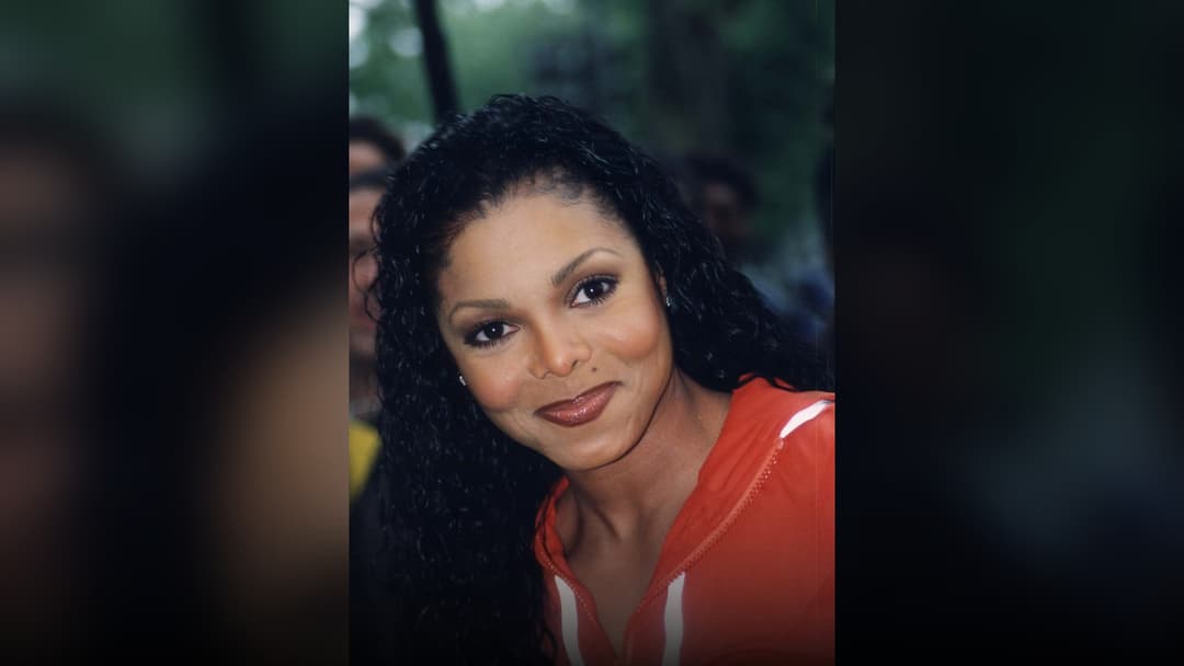 Janet Jackson smiling on the red carpet at the BET Awards