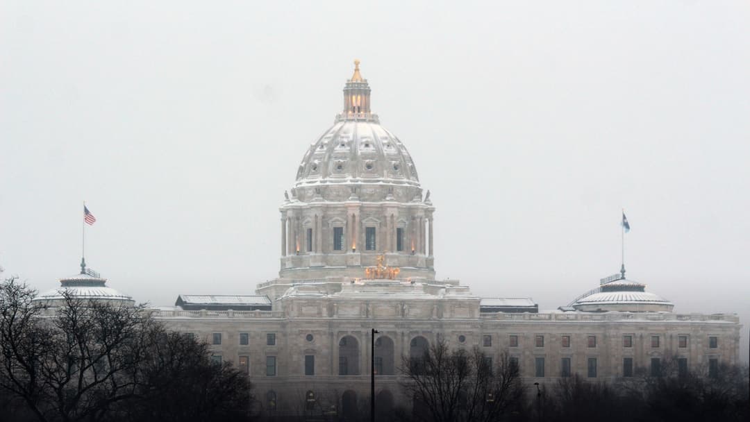 The Minnesota State Capitol building in Saint Paul blanketed in thick winter snow.