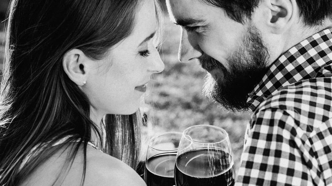 Man and woman gazing warmly into each other's eyes in a close-up profile portrait