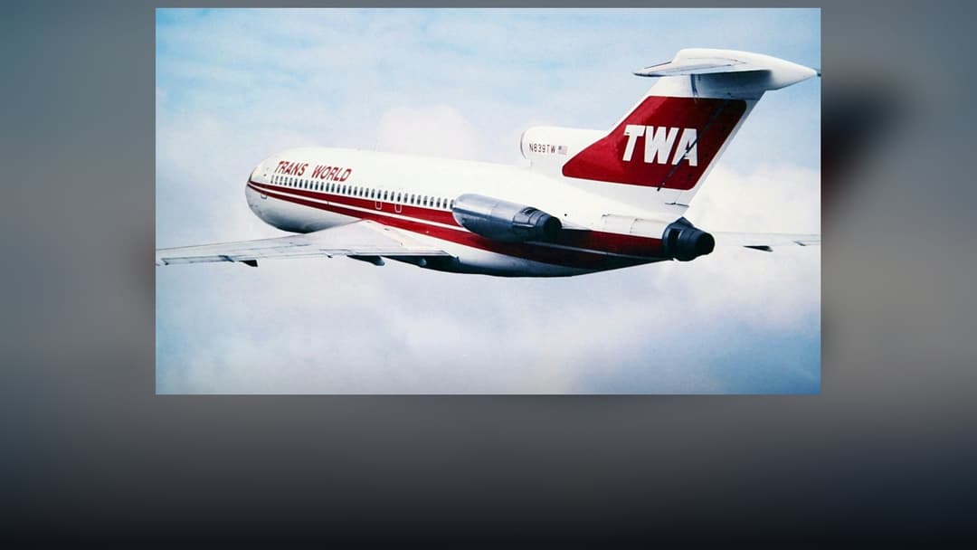 Trans World Airlines (TWA) Boeing 727 tri-jet airliner in classic twin-globe red-stripe livery.