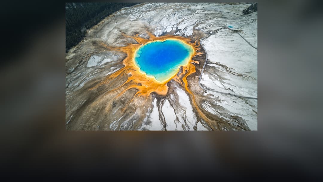 Panoramic landscape vista of Yellowstone National Park showing natural geological formations, terrain, and wilderness.