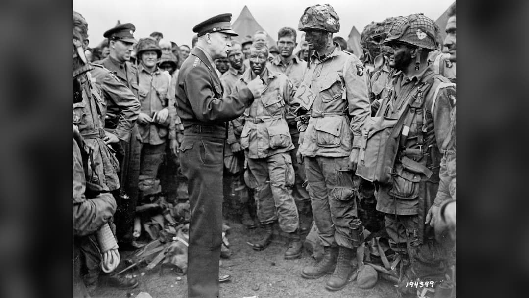 General Dwight D. Eisenhower speaking with US Army paratroopers of the 101st Airborne Division in England on June 5, 1944.