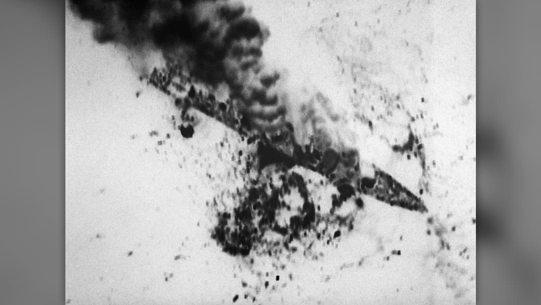 Archival U.S. Navy aerial photograph of an Iranian warship burning during Operation Praying Mantis in April 1988.