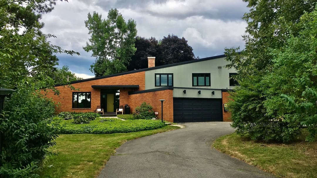 Two-car attached residential garage with a concrete driveway
