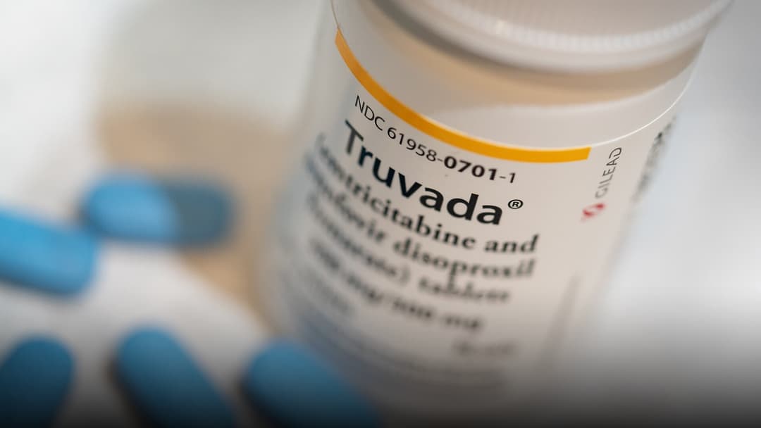 An authentic American prescription pill bottle with warning labels, Rx dosage instructions, and blue tablets.