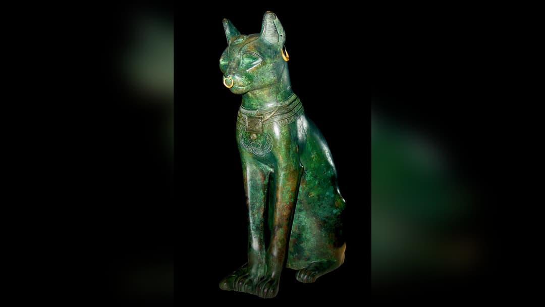 The historic bronze Gayer-Anderson cat statue from Ancient Egypt displayed in the British Museum.