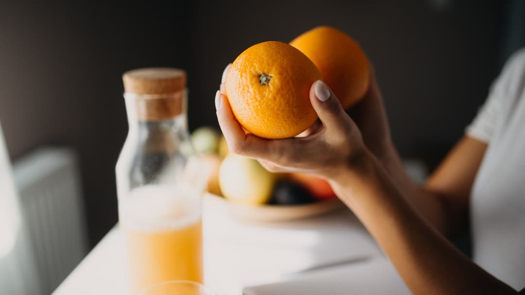 Glass and bottle of orange fruit juice