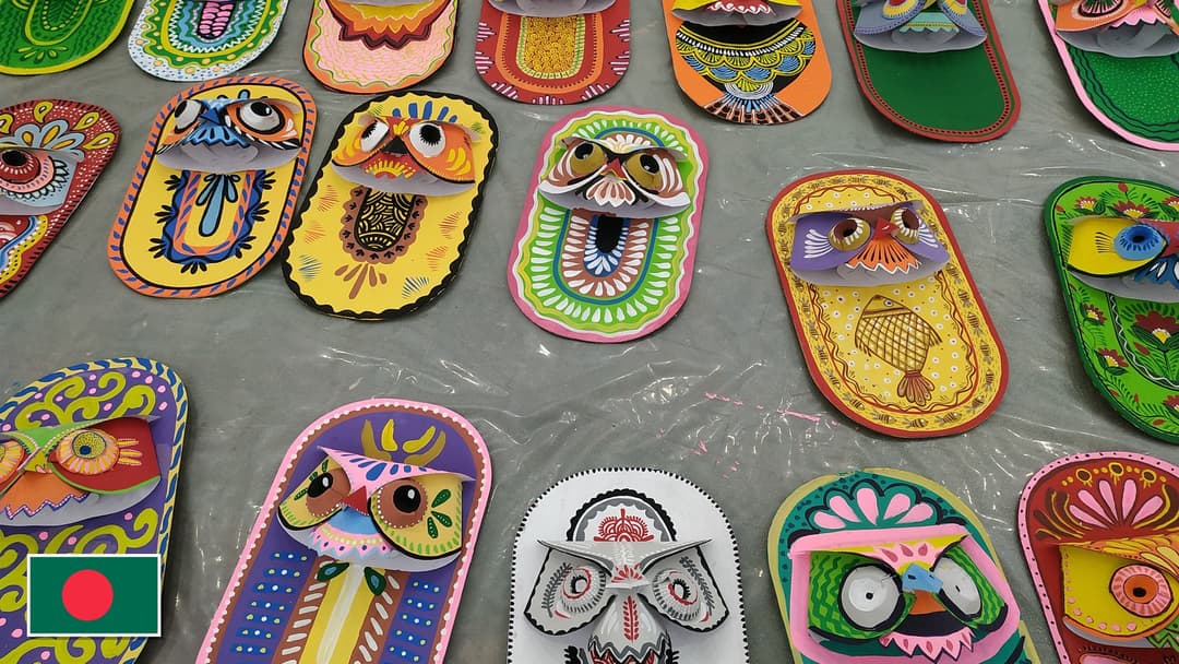 Pohela Boishakh Bengali New Year folk art masks in Dhaka, Bangladesh with the Bangladeshi flag in the bottom left corner