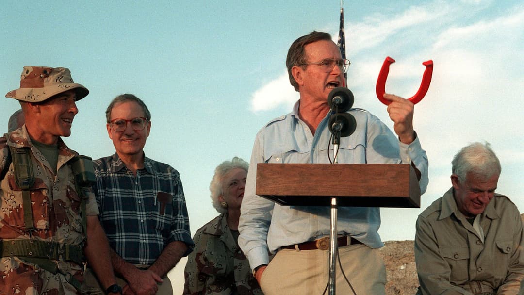 President and former WWII US Navy pilot George H.W. Bush addressing US Marines and Navy Seabees at a desert camp in 1990.
