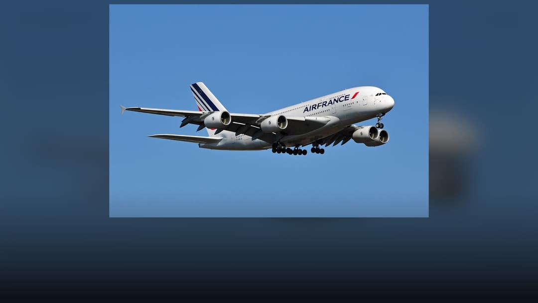 Air France Airbus A380-861 in official livery on runway under clear blue skies.