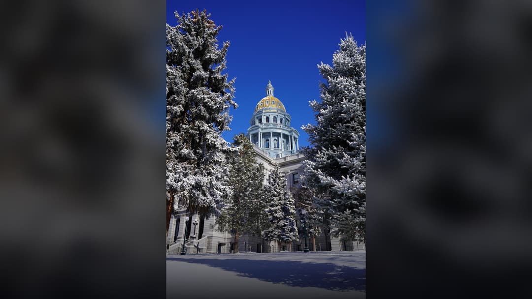 The Colorado State Capitol building in Denver surrounded by deep December snowdrifts.