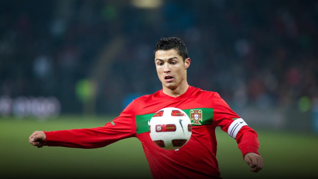 Cristiano Ronaldo competing for Portugal against Argentina in an international match.