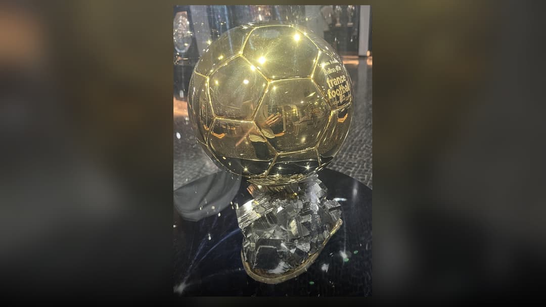 Golden individual football award trophy on display inside the CR7 Museum trophy room.