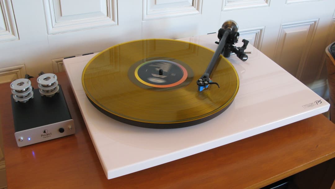 Audiophile turntable playing colored vinyl record
