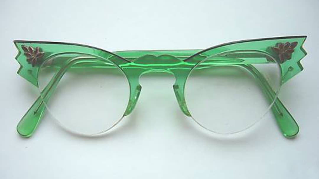 19. Rhinestone-Tipped Upswept Cat-Eye Glasses