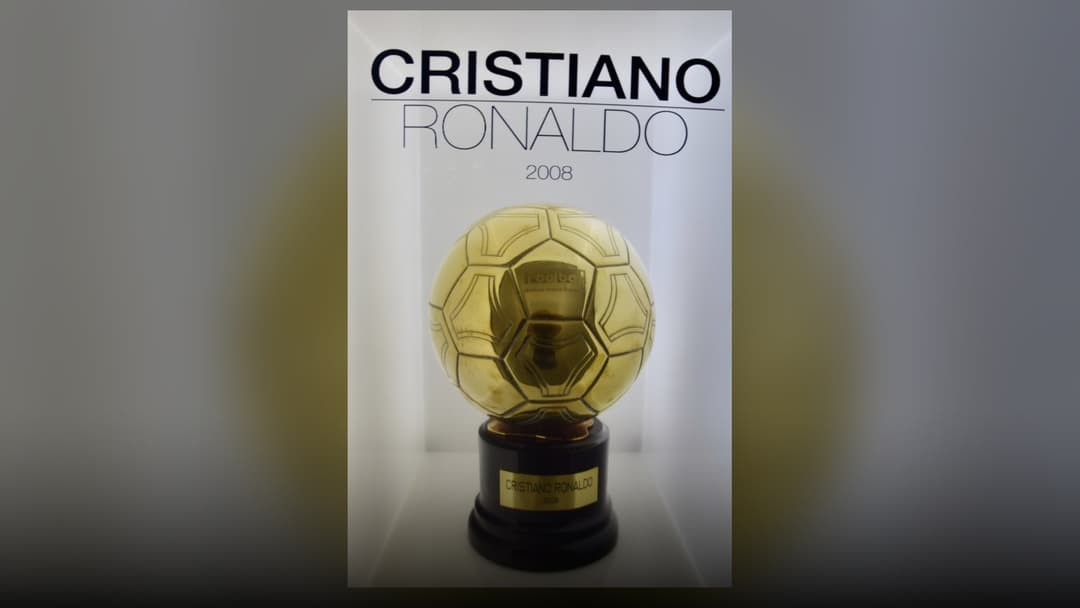 Cristiano Ronaldo's 2008 Ballon d'Or trophy displayed inside the Real Madrid Museum at Santiago Bernabéu.
