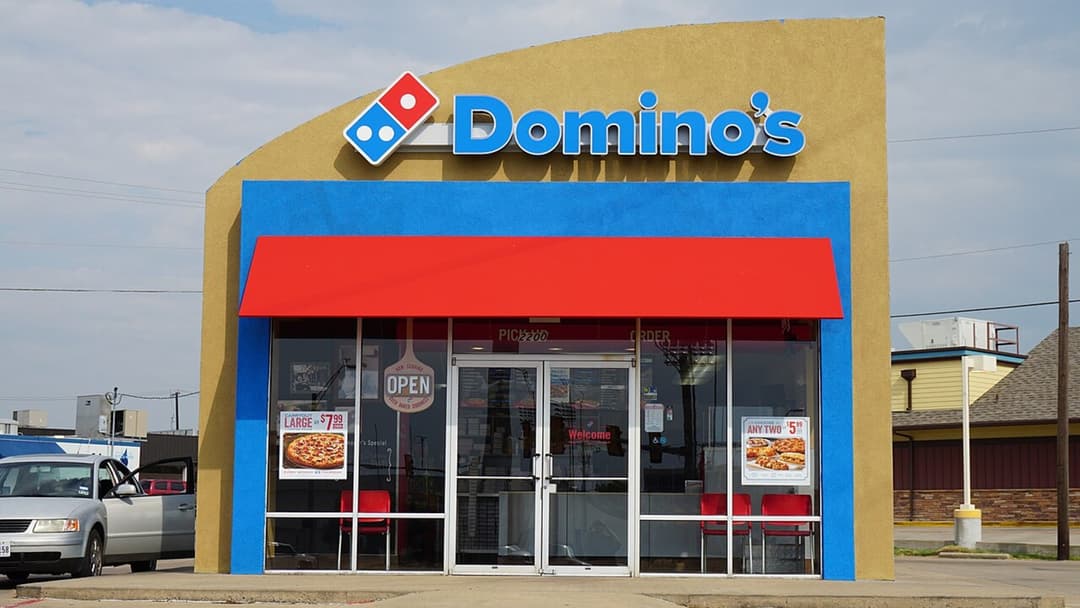 Exterior storefront photograph of Domino's Pizza location in the United States.