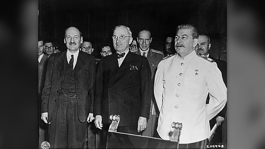 President Harry S. Truman seated alongside Allied leaders and military commanders at the 1945 Potsdam Conference.