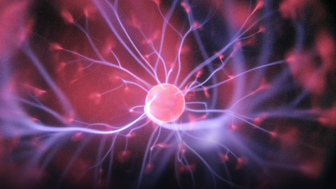 Microscopic neural synapse network firing in glowing blue and violet light.