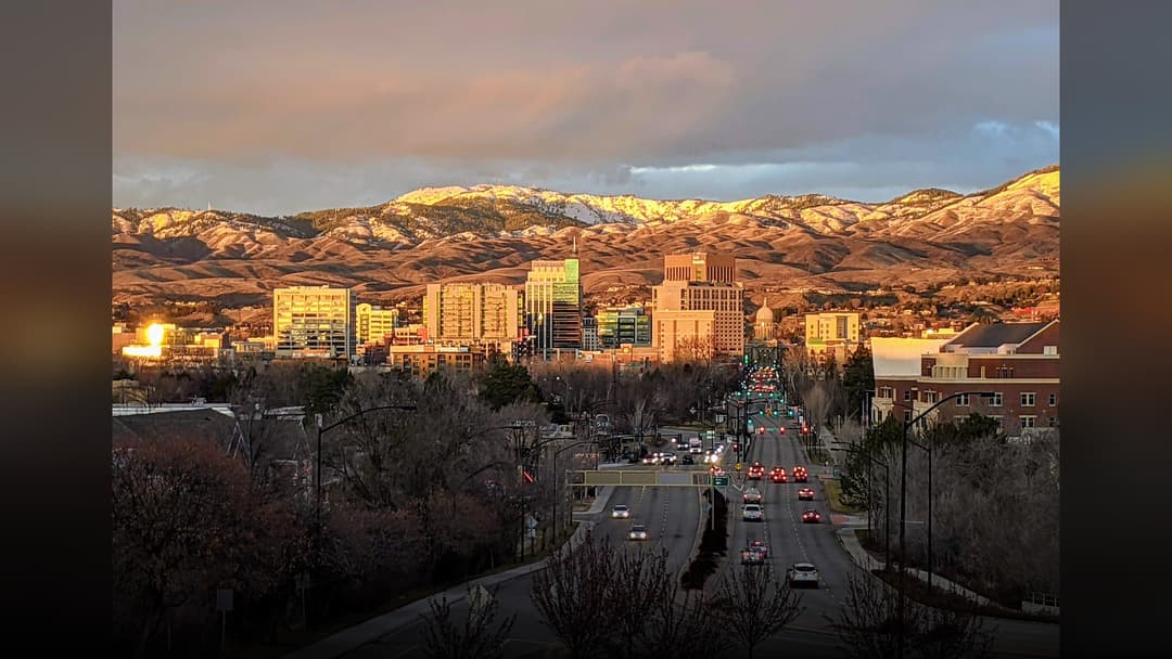 Panoramic view of Boise downtown skyline backed by the scenic Boise Foothills in Idaho.