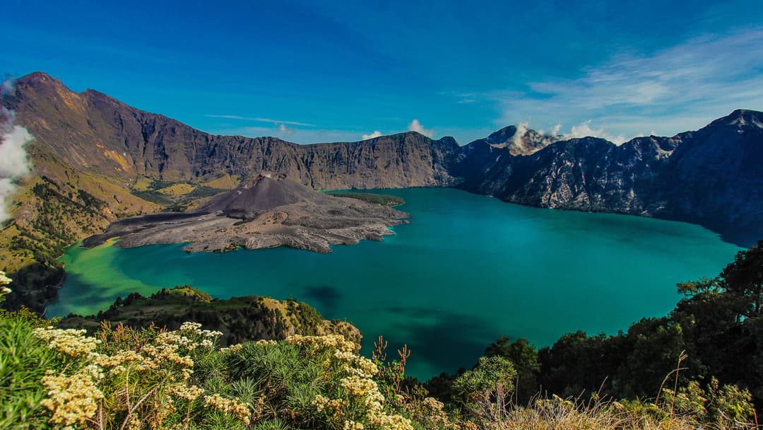 Segara Anak crater lake and volcanic cone inside the Mount Rinjani caldera on Lombok, Indonesia.