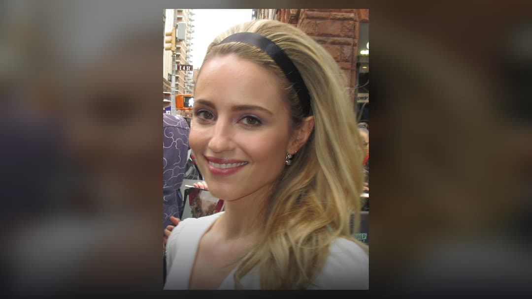 Dianna Agron posing gracefully on the red carpet