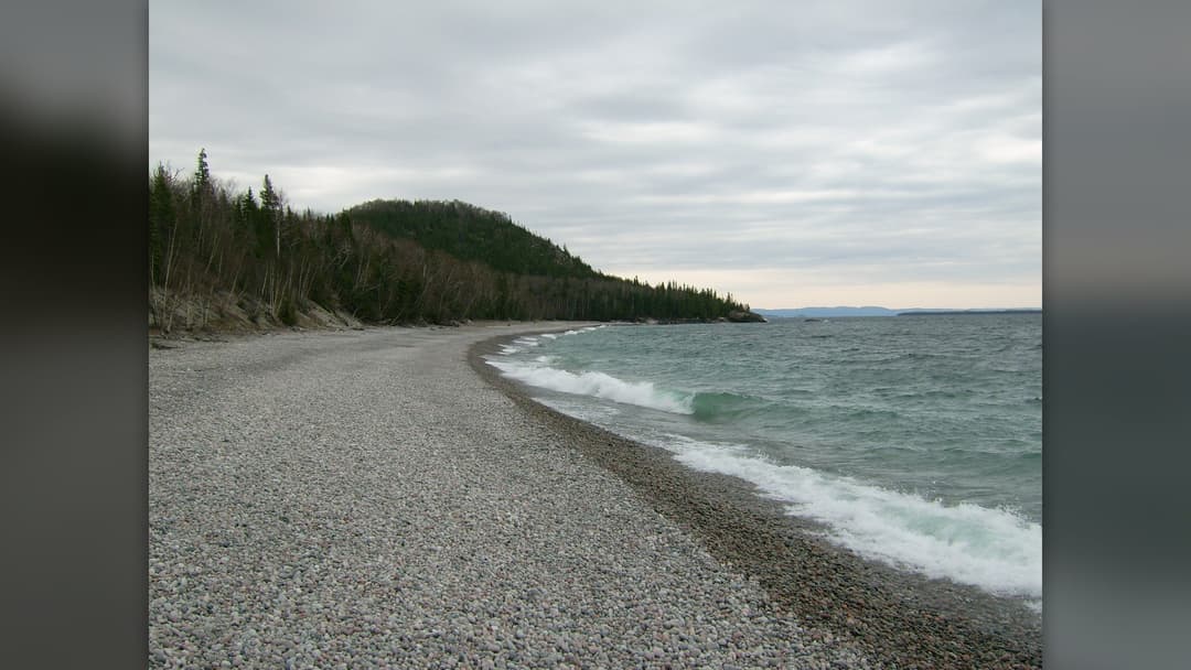 Rocky shoreline of Lake Superior with clear blue waters