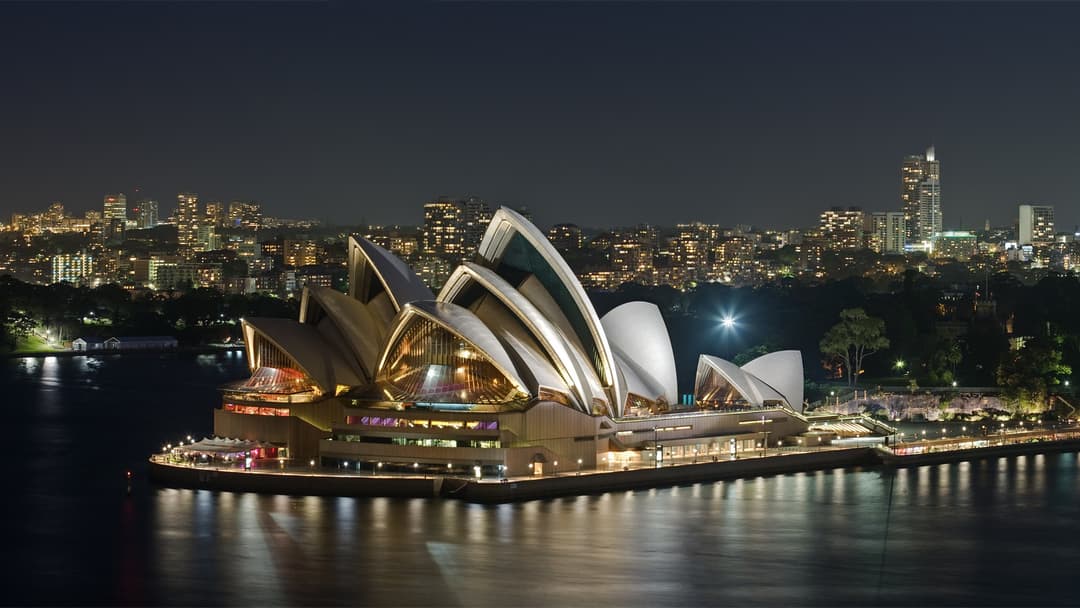 Harbor view of the Sydney Opera House with its sail-shaped roofs