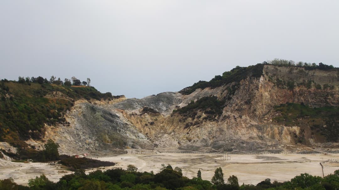 Steaming sulfur fumaroles and crater floor of Solfatara in the Campi Flegrei caldera near Naples, Italy.