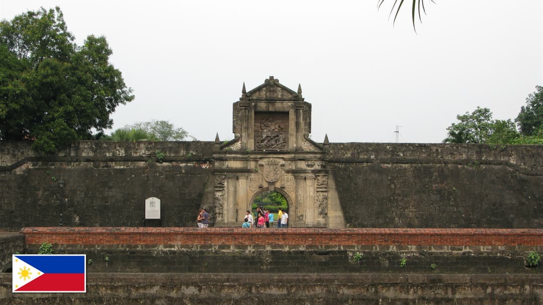 Historic gate of Fort Santiago in Intramuros, Manila, Philippines with the Philippine flag in the bottom left corner