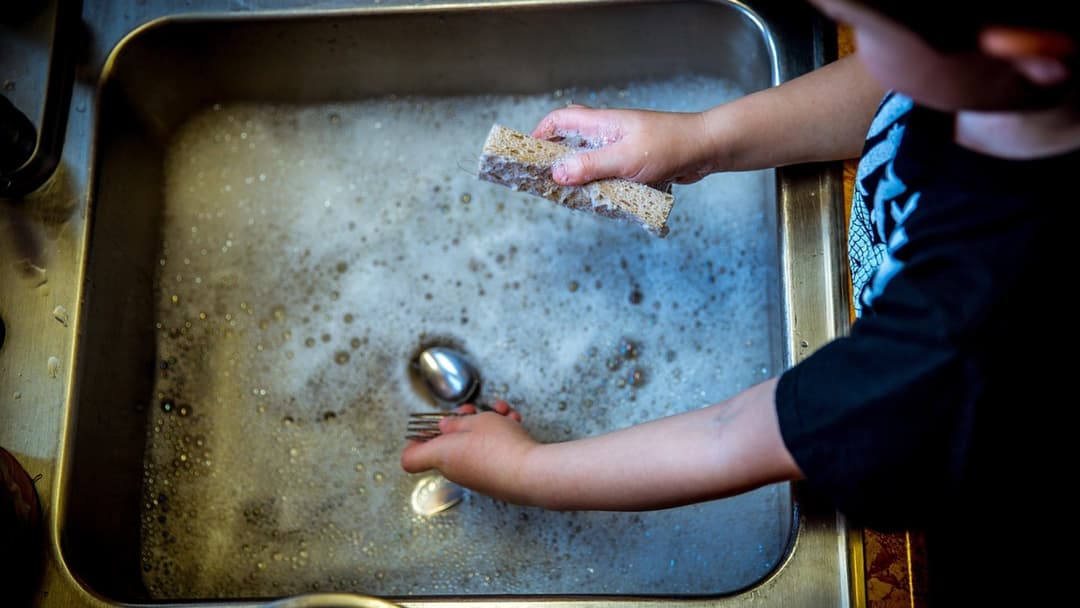 14. Putting A Small Plastic Bowl In The Sink
