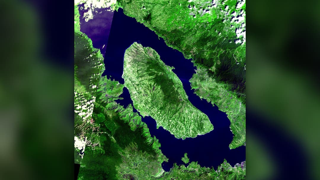 Satellite view of the 100-kilometer-long Lake Toba supervolcano caldera and Samosir Island in Sumatra, Indonesia.